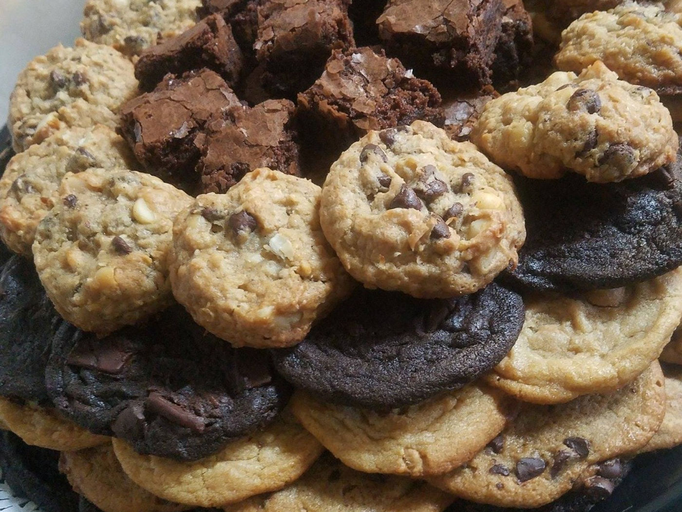 A tray of cookies and brownies from the deli case