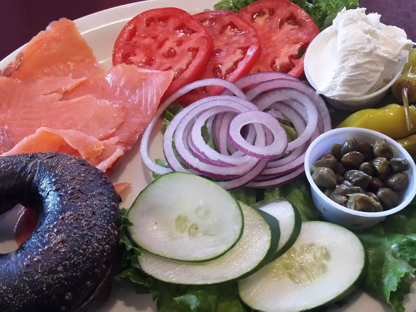 A Goldman's lox platter with bagels, tomato, onion and capers